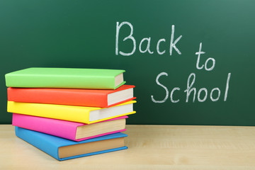 Books and blackboard. Back to school.