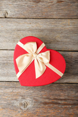 Beautiful gift box on grey wooden background