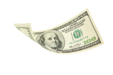 Hundred dollar bill falling on white background