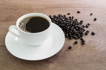 cup of black coffee and beans