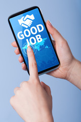 Man presses a touch screen smart phone with the symbol of  good