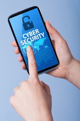Man presses a touch screen smart phone with the symbol of cyber