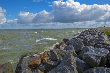 Deteriorating weather over a dike along a sea