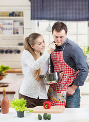 Young couple cooking together