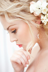 Portrait of beauty bride with flowers in hair