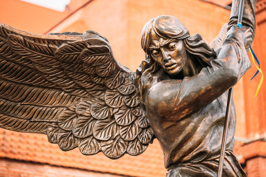 Statue Of Archangel Michael With Outstretched Wings Before Red C - Powered by Adobe