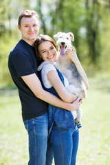 Happy young couple and  dog