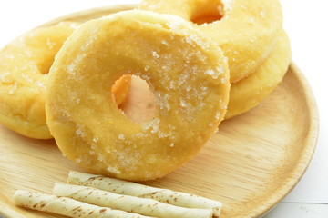 Morning breakfast with sugary donuts and candy