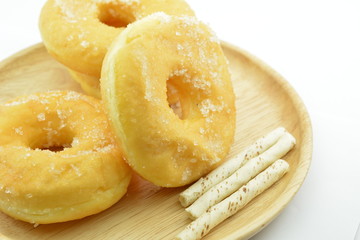 Morning breakfast with sugary donuts and candy