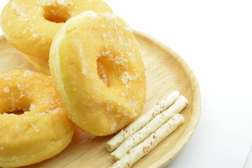 Morning breakfast with sugary donuts and candy