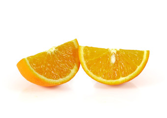 Two orange fruit segments or cantles isolated on white backgroun