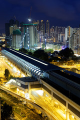 Fototapeta na wymiar hong kong urban downtown and high speed train at night