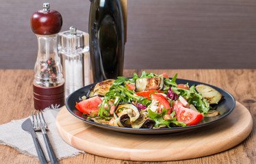Eggplant salad with tomatoes and arugula