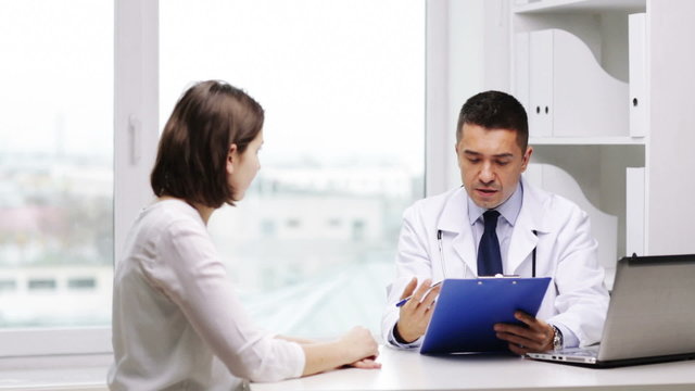 doctor and young woman meeting at hospital