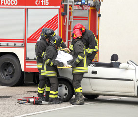 firefighters relieve an injured after car accident