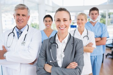 Fototapeta premium Smiling team of doctors looking at camera
