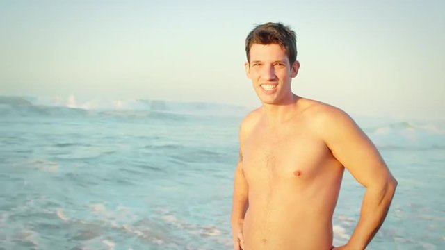 Brazilian man smiles on a beach in Brazil