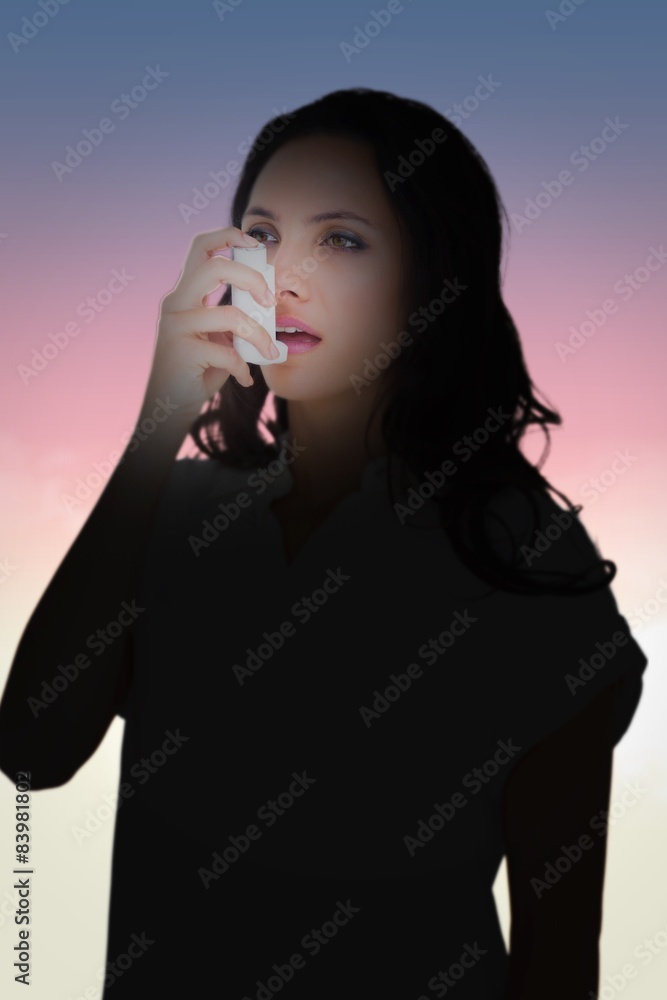 Poster composite image of asthmatic brunette using her inhaler