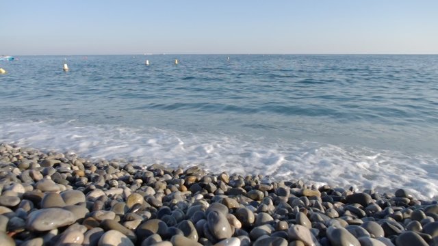 Sea waves dumping on pebble beach