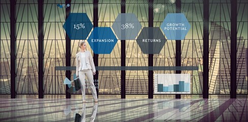 Composite image of businesswoman holding briefcase