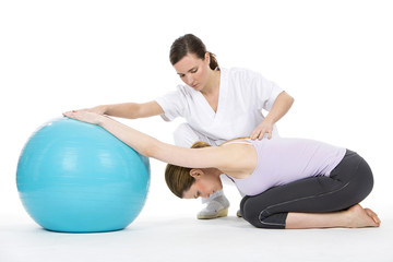 woman with physiotherapist exercising 