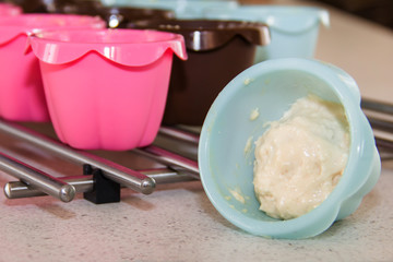 colorful muffin tins with homemade dough