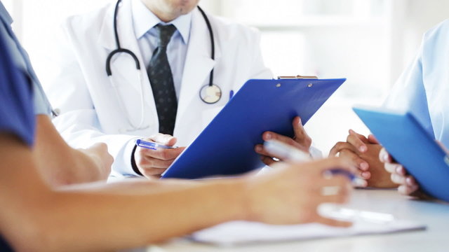 group of doctors at meeting in hospital