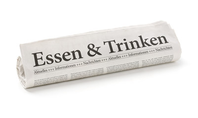 Zeitungsrolle mit der &Uuml;berschrift Essen und Trinken