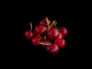 Fototapeta na wymiar Cherries on a black background
