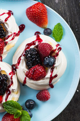 Homemade pavlova meringue with summer fresh berries