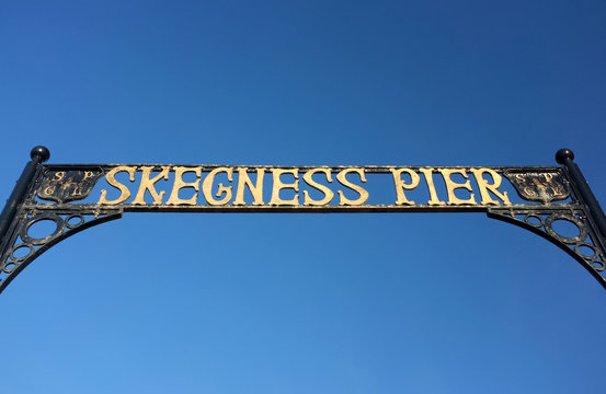 Skegness Pier entrance against a blue sky