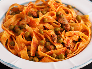 Bowl of noodles with sauce of peas