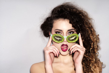 Fashionable young sexy girl in fruit glasses