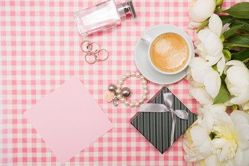 Gift box and a bouquet of peonies