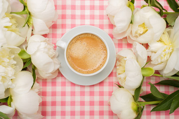 Coffee and a bouquet of peonies