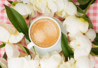 Coffee and a bouquet of peonies