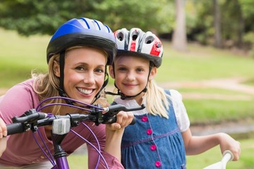 Mother and her daughter on their bike 