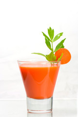 glass of Fresh organic carrot juice .