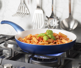 pan with macaroni on the fire