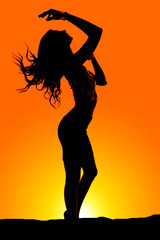silhouete of a fit woman hair flow hand over head