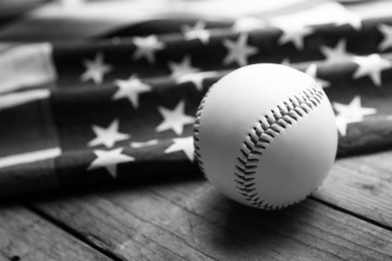 baseball with American flag in the background, black and white c