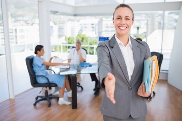 Smiling businesswoman introducing herself 