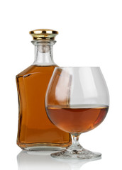 Glass of cognac with bottle