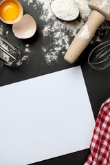 Baking bakery kitchen background with checkered tablecloth and food ingredients