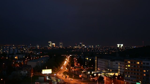 night city - urban street with cars - lights - dark sky - sunset timelapse