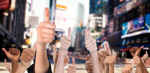 Composite image of hands showing thumbs up