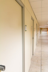 beige hospital hallway; empty hospital corridor; hospital interi