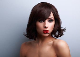 Fototapeta premium Sexy makeup woman with short black hair style and red lipstick