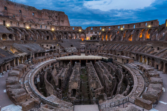 Internal view of the Coliseum at night in Rome, Italy. 