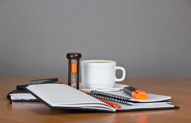 Open notepad, marker pencil, the calculator, hourglasses